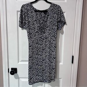 Navy dress with white flowers and lace front detail